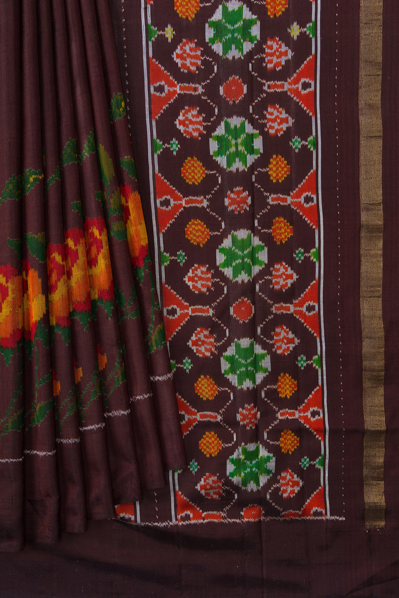 Pleats and pallu of Brown Dual Tone Double Ikat Saree with Plain Body and Ikat Border. 