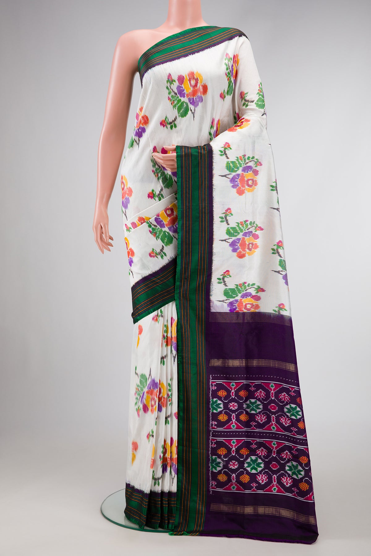 Off White Dual Tone Double Ikat Saree with Ikat Print on the body and Zari Border.  displayed on a mannequin