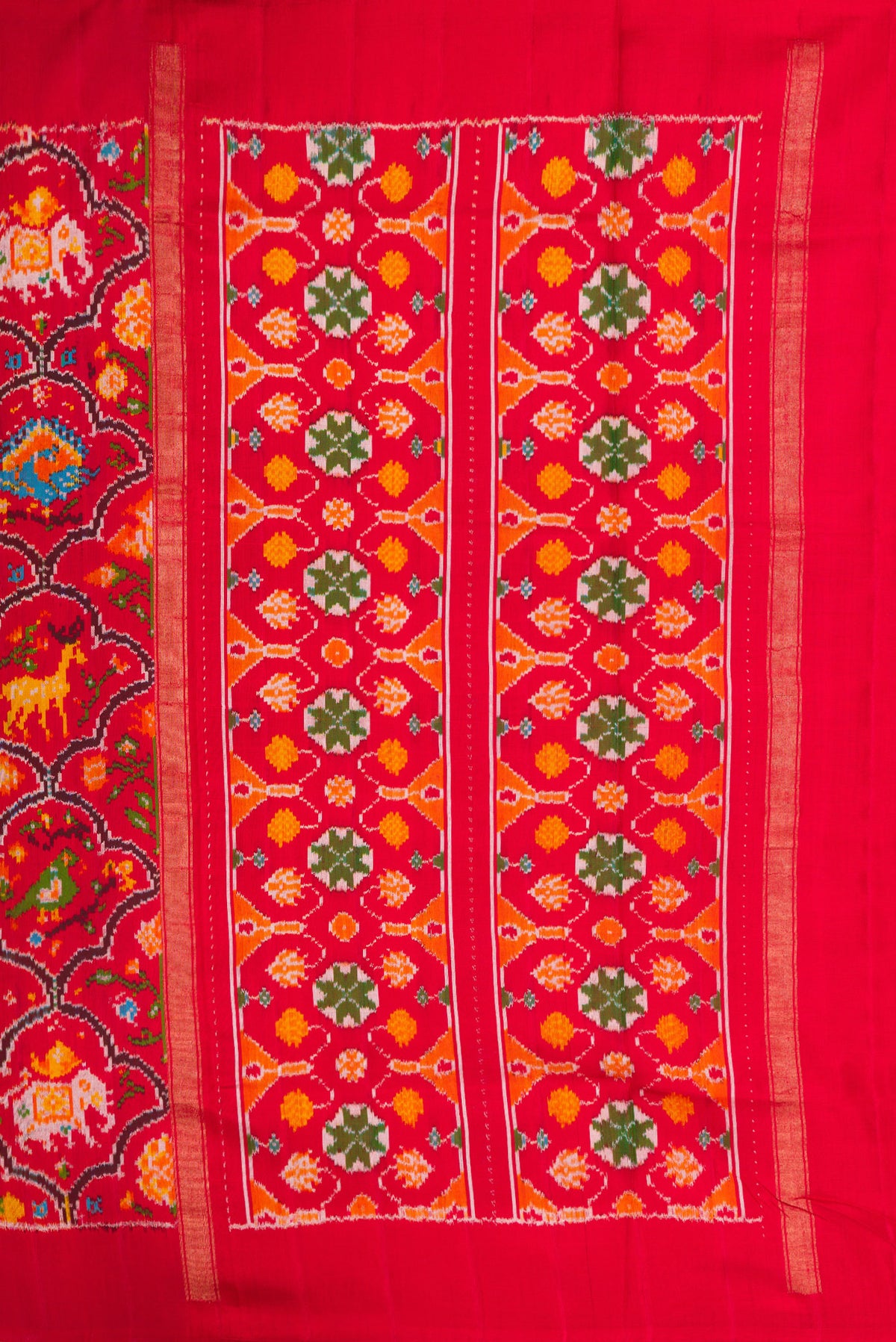 Close up image of the pallu of Red Dual Tone Double Ikat Saree with Ikat Print on the body and Plain Border. 