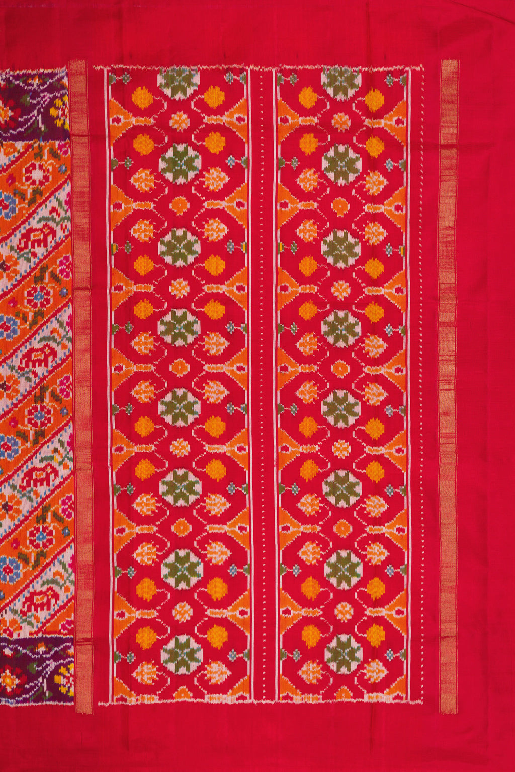 Close up image of the pallu of Brick Orange Dual Tone Double Ikat Saree with Ikat Print on the body and Ikat Border. 