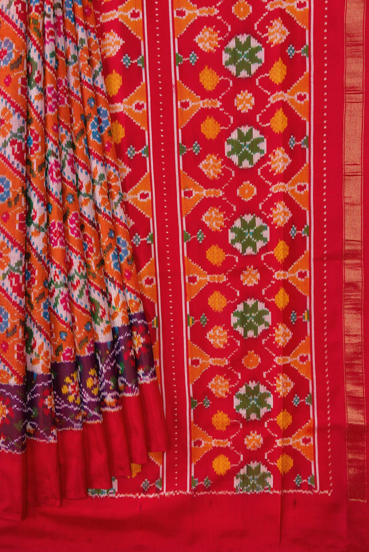 Pleats and pallu of Brick Orange Dual Tone Double Ikat Saree with Ikat Print on the body and Ikat Border. 