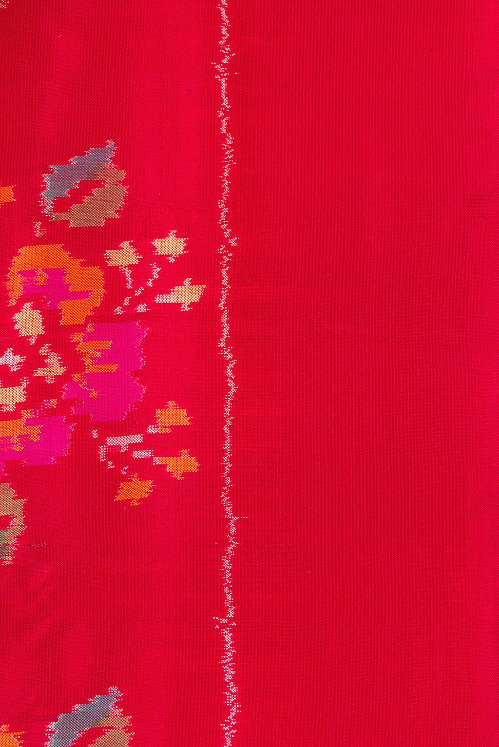Border image of Red Dual Tone Double Ikat Saree with Ikat Print on the body and Zari Border. 