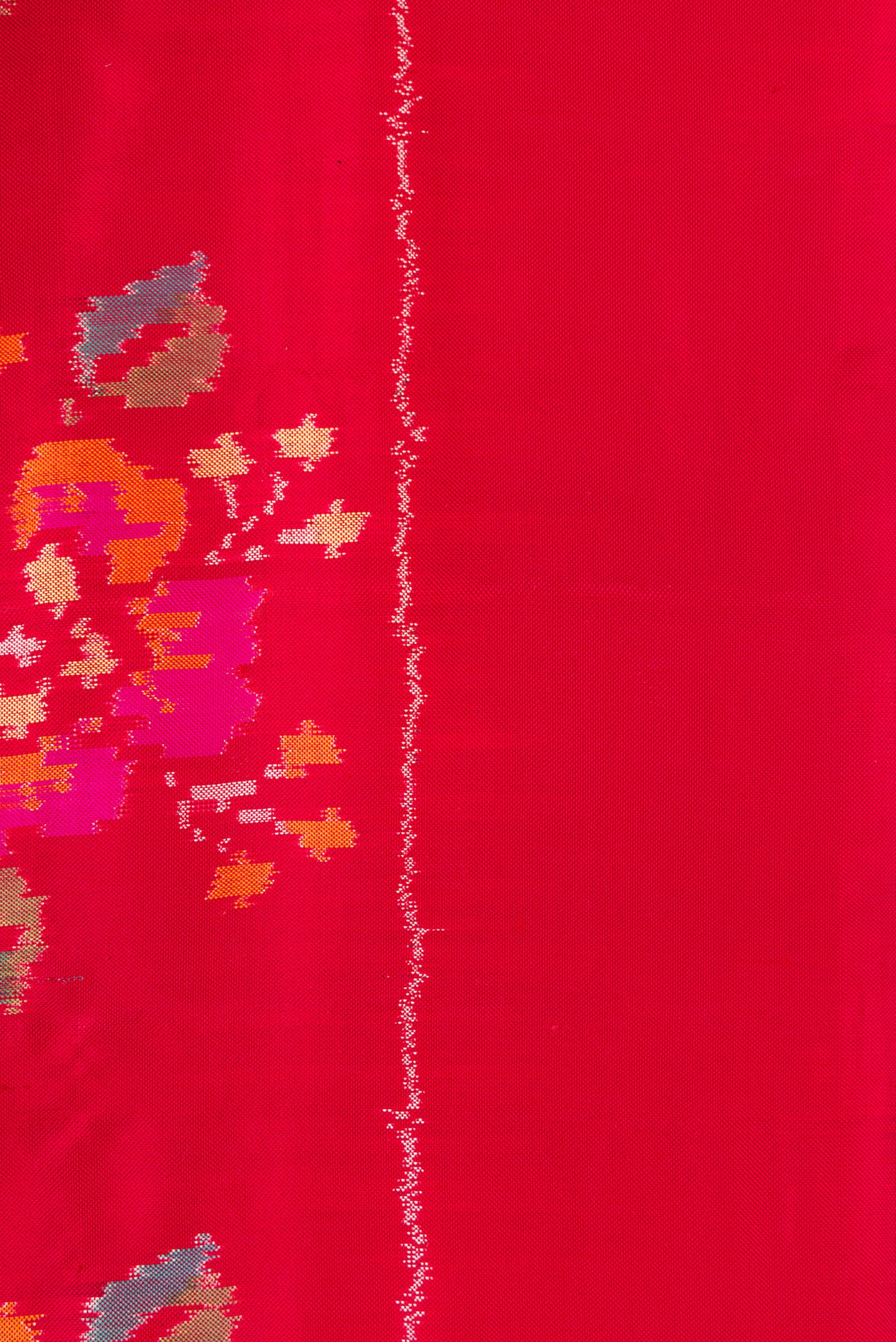 Border image of Red Dual Tone Double Ikat Saree with Ikat Print on the body and Zari Border. 
