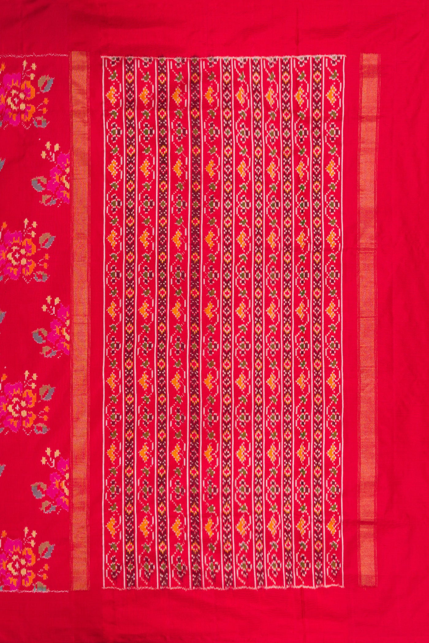 Close up image of the pallu of Red Dual Tone Double Ikat Saree with Ikat Print on the body and Zari Border. 