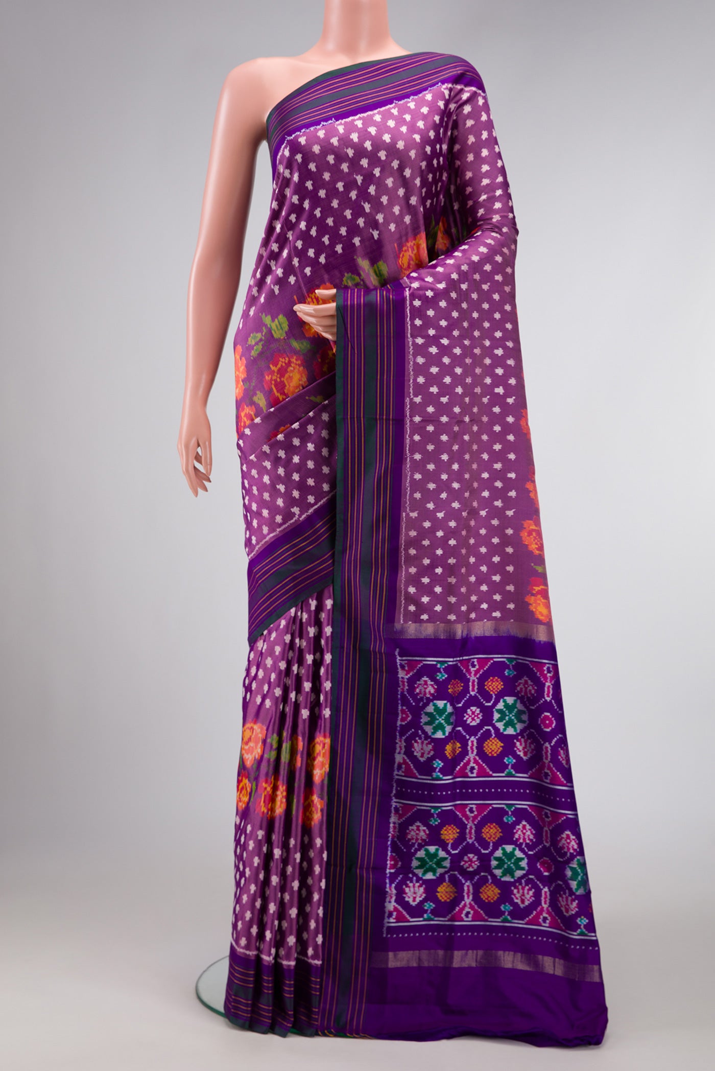 Purple Dual Tone Double Ikat Saree with Ikat Print on the body and Thread Border.  displayed on a mannequin