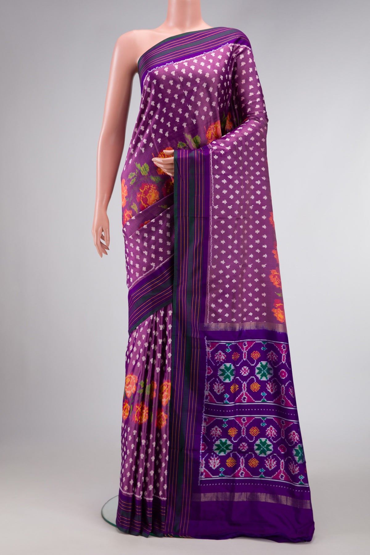 Purple Dual Tone Double Ikat Saree with Ikat Print on the body and Thread Border.  displayed on a mannequin
