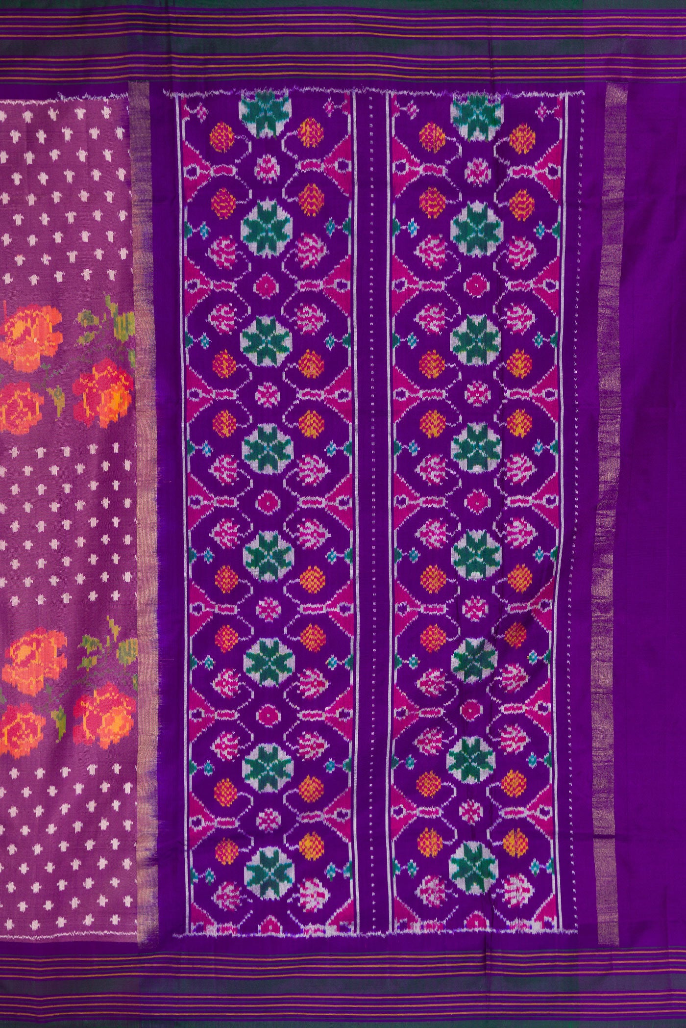 Close up image of the pallu of Purple Dual Tone Double Ikat Saree with Ikat Print on the body and Thread Border. 