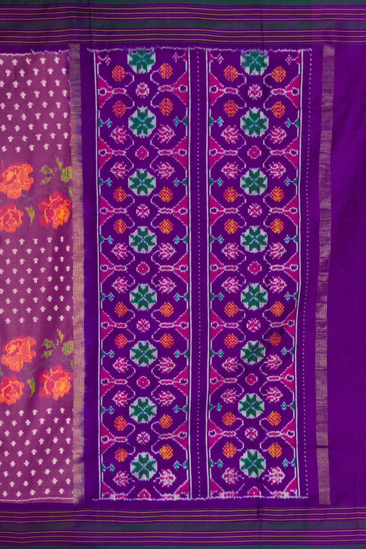 Close up image of the pallu of Purple Dual Tone Double Ikat Saree with Ikat Print on the body and Thread Border. 