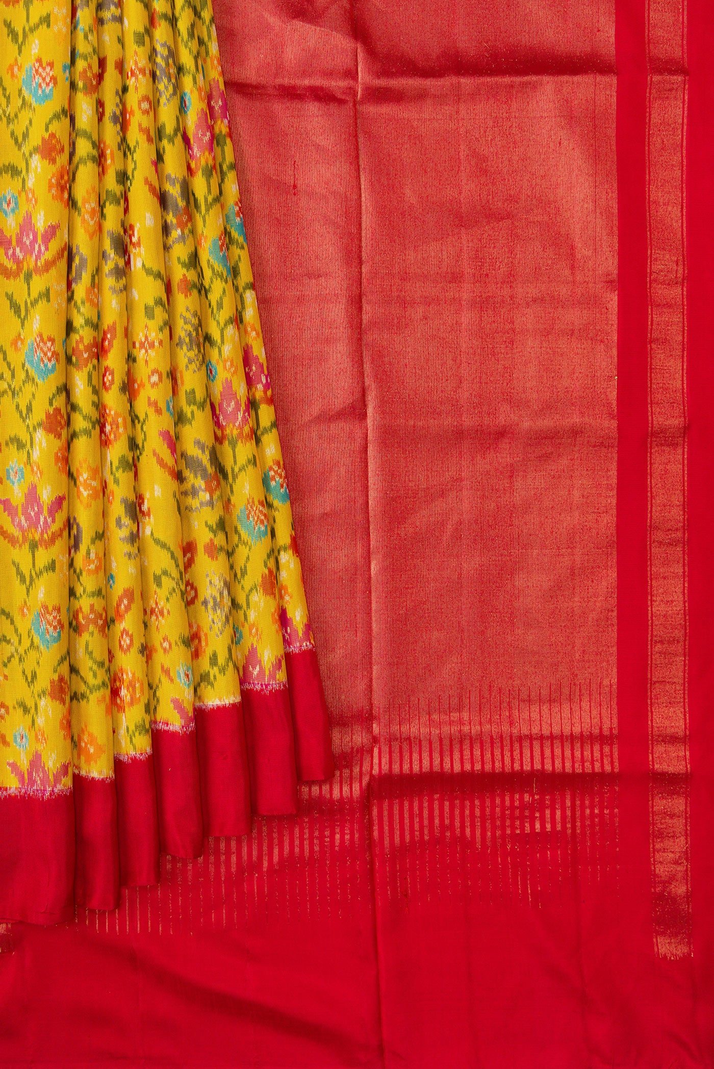 Pleats and pallu of Yellow Dual Tone Double Ikat Saree with Ikat Print on the body and Plain Border. 