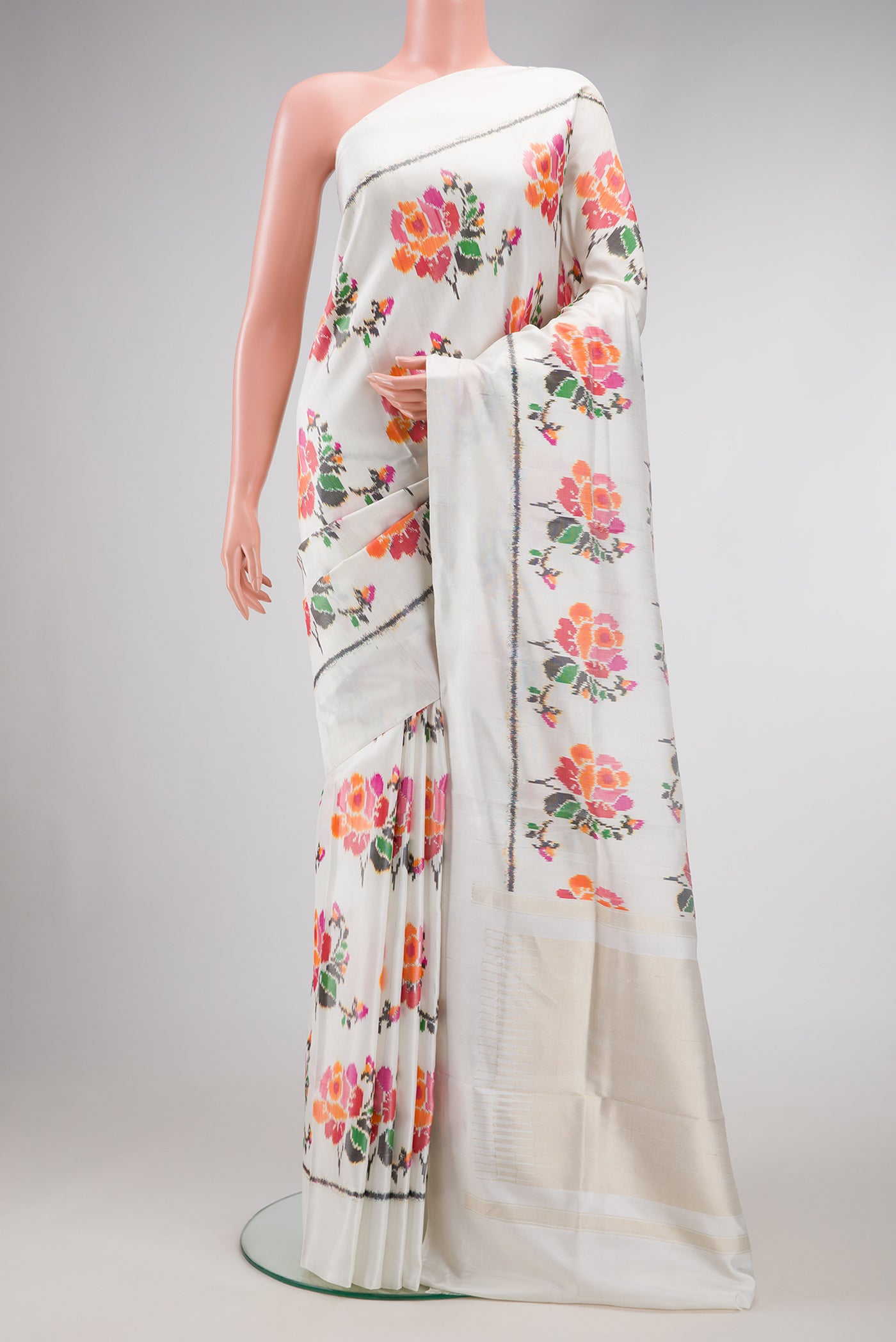 Off White Dual Tone Double Ikat Saree with Ikat Print on the body and Plain Border.  displayed on a mannequin