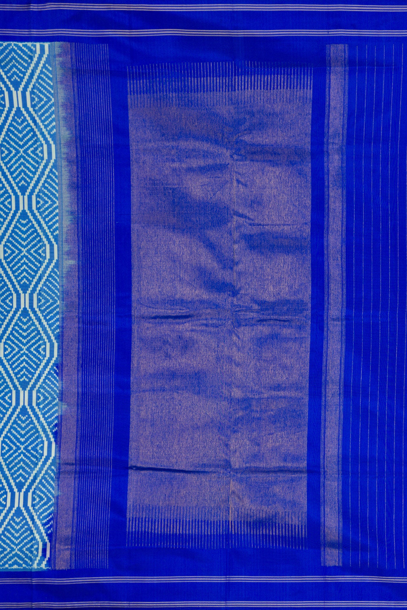 Close up image of the pallu of Sky Blue Dual Tone Double Ikat Saree with Ikat Print on the body and Thread Border. 