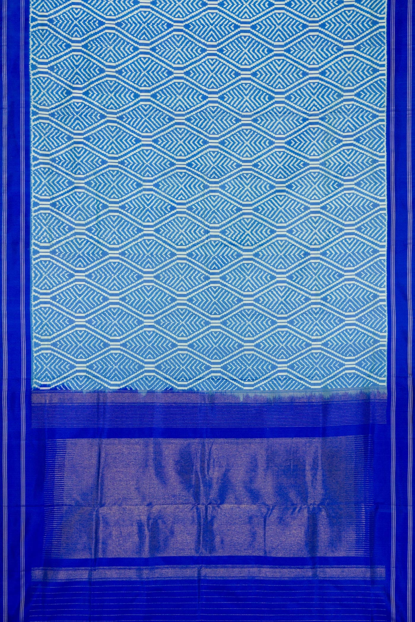 Flat view of Sky Blue Dual Tone Double Ikat Saree with Ikat Print on the body and Thread Border. 