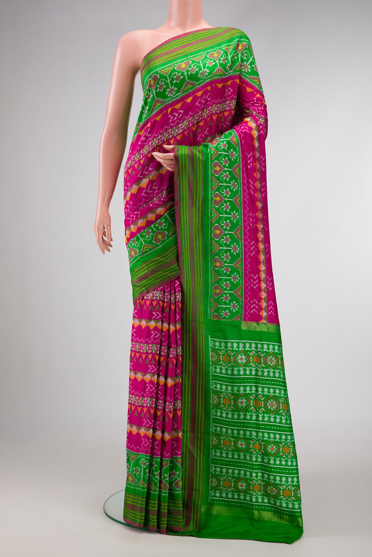 Pink Dual Tone Double Ikat Saree with Ikat Print on the body and Ikat Border.  displayed on a mannequin