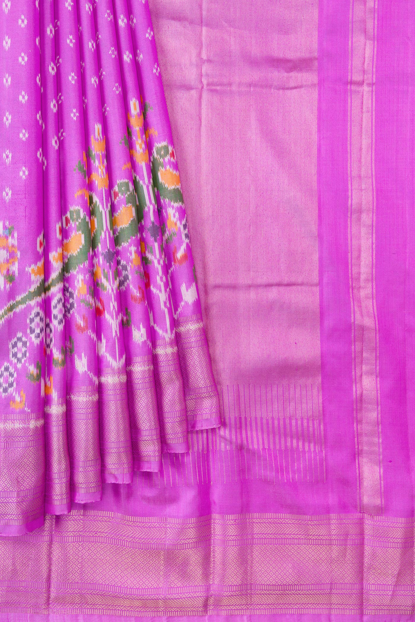Pleats and pallu of Pink Dual Tone Double Ikat Saree with Ikat Print on the body and Ikat Border. 