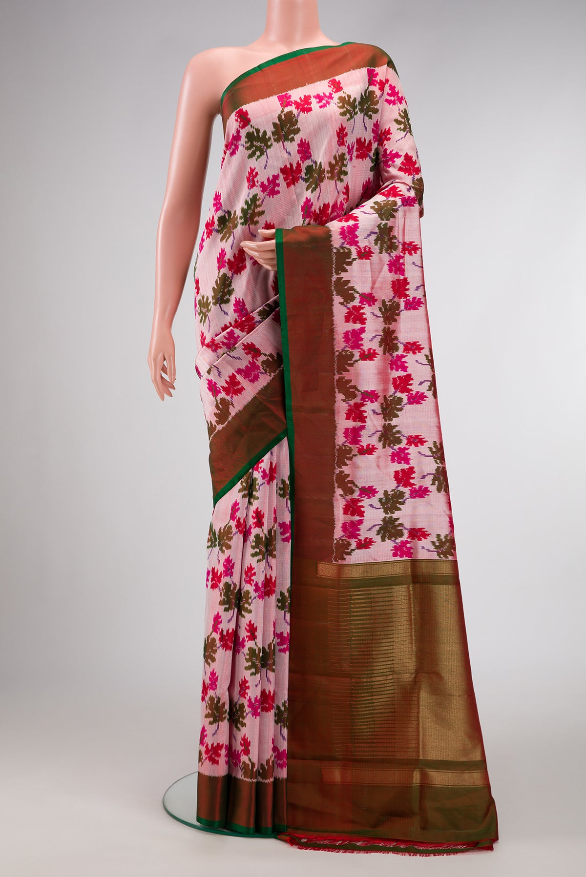 Pink Dual Tone Double Ikat Saree with Ikat Print on the body and Zari Border.  displayed on a mannequin