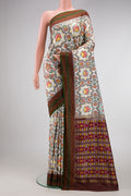 Beige Dual Tone Double Ikat Saree with Ikat Print on the body and Thread Border.  displayed on a mannequin