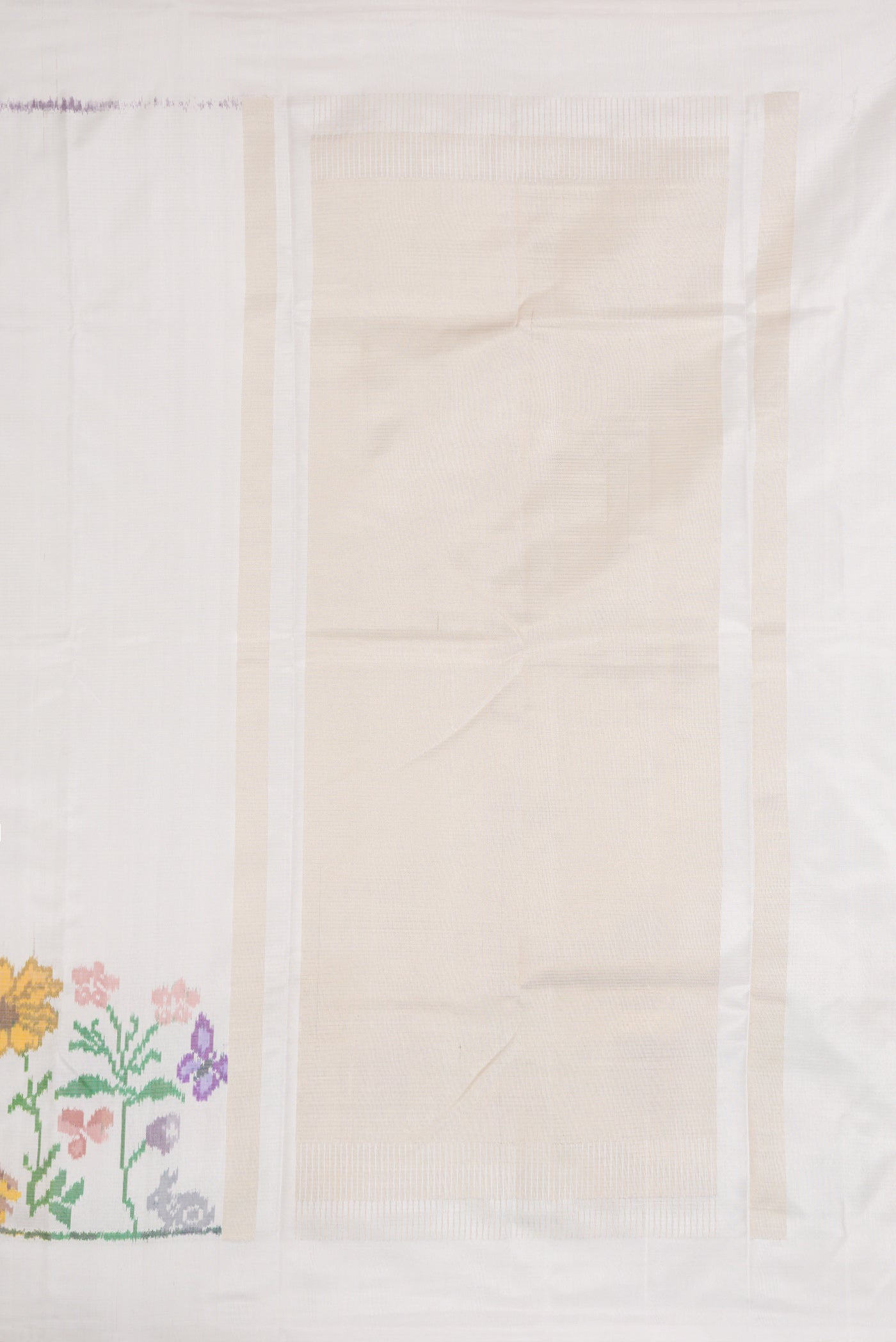Close up image of the pallu of Off White Dual Tone Double Ikat Saree with Plain Body and Ikat Border. 