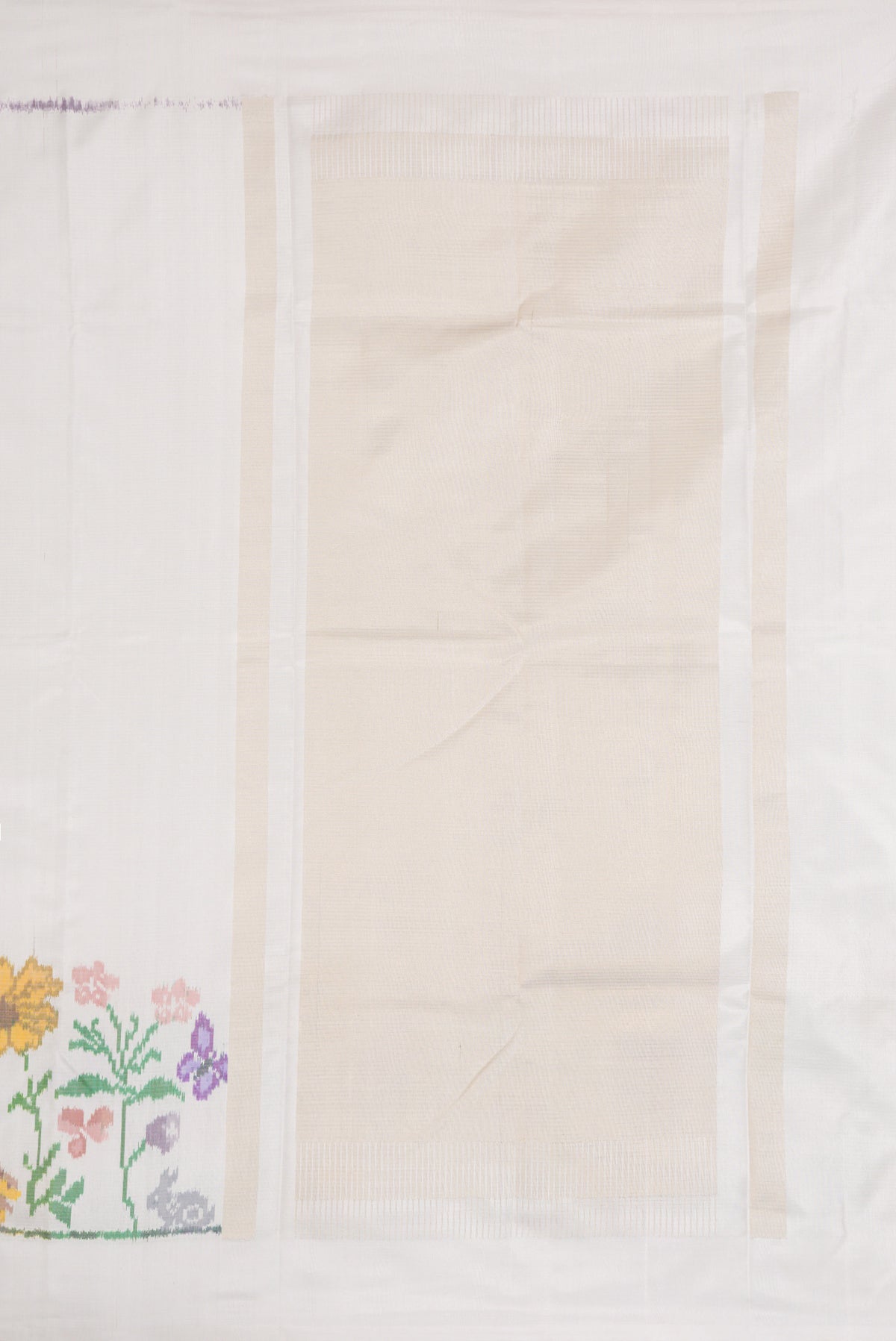 Close up image of the pallu of Off White Dual Tone Double Ikat Saree with Plain Body and Ikat Border. 