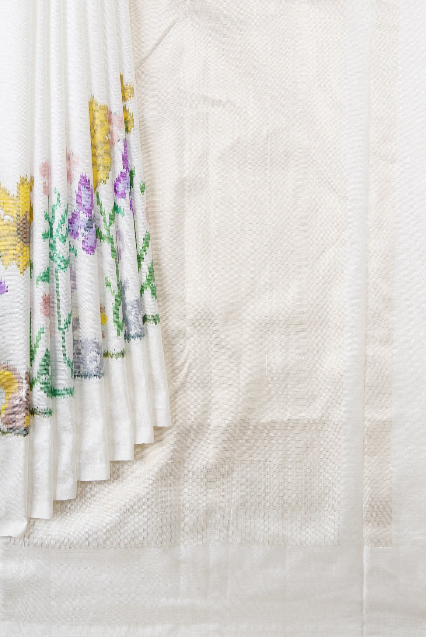 Pleats and pallu of Off White Dual Tone Double Ikat Saree with Plain Body and Ikat Border. 