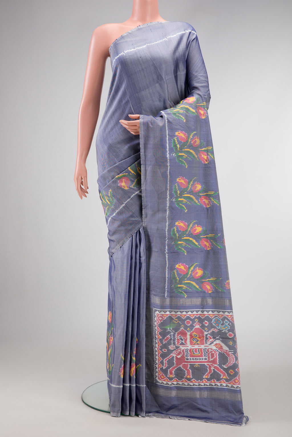 Grey Dual Tone Double Ikat Saree with Plain Body and Fancy Border.  displayed on a mannequin