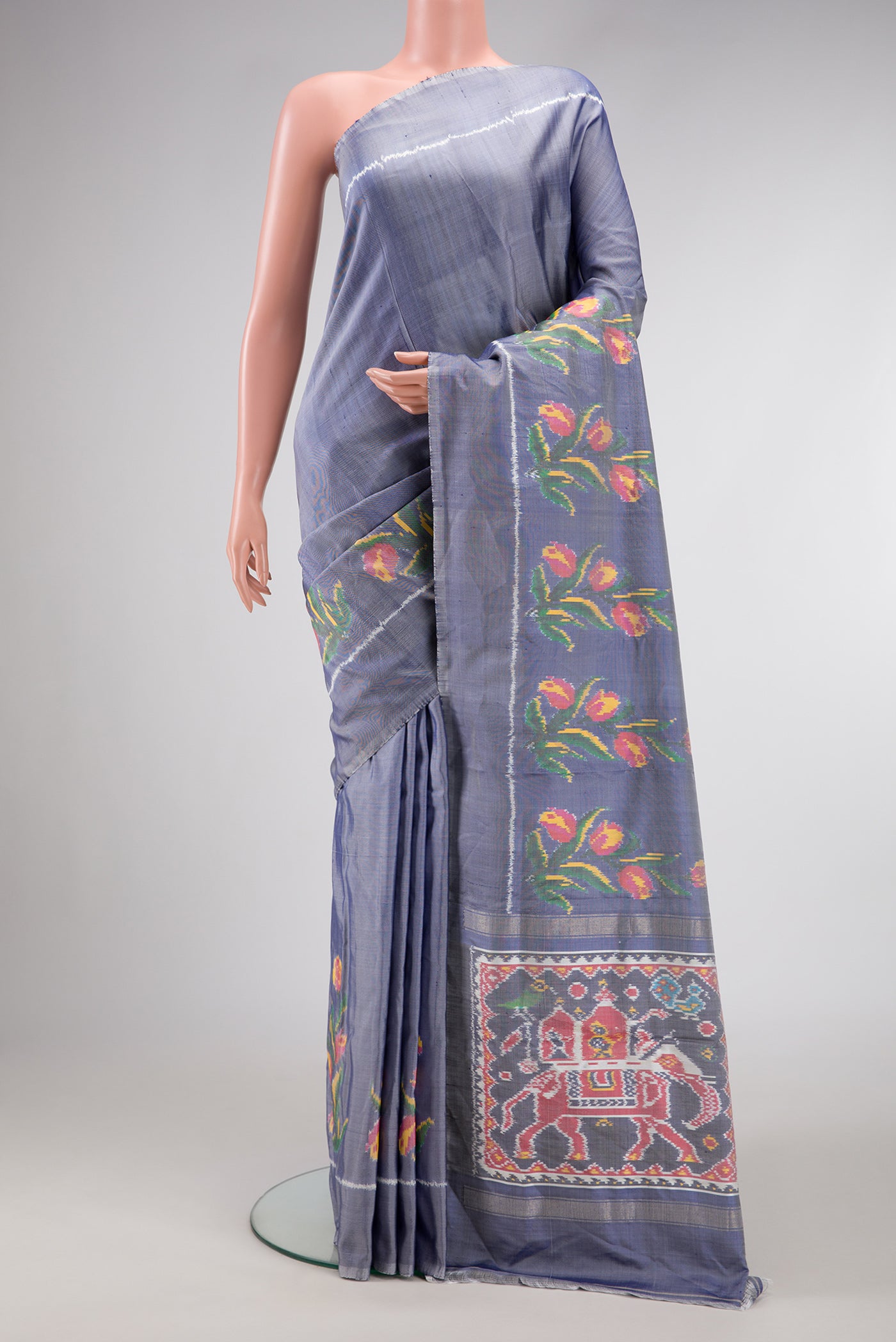 Grey Dual Tone Double Ikat Saree with Plain Body and Fancy Border.  displayed on a mannequin