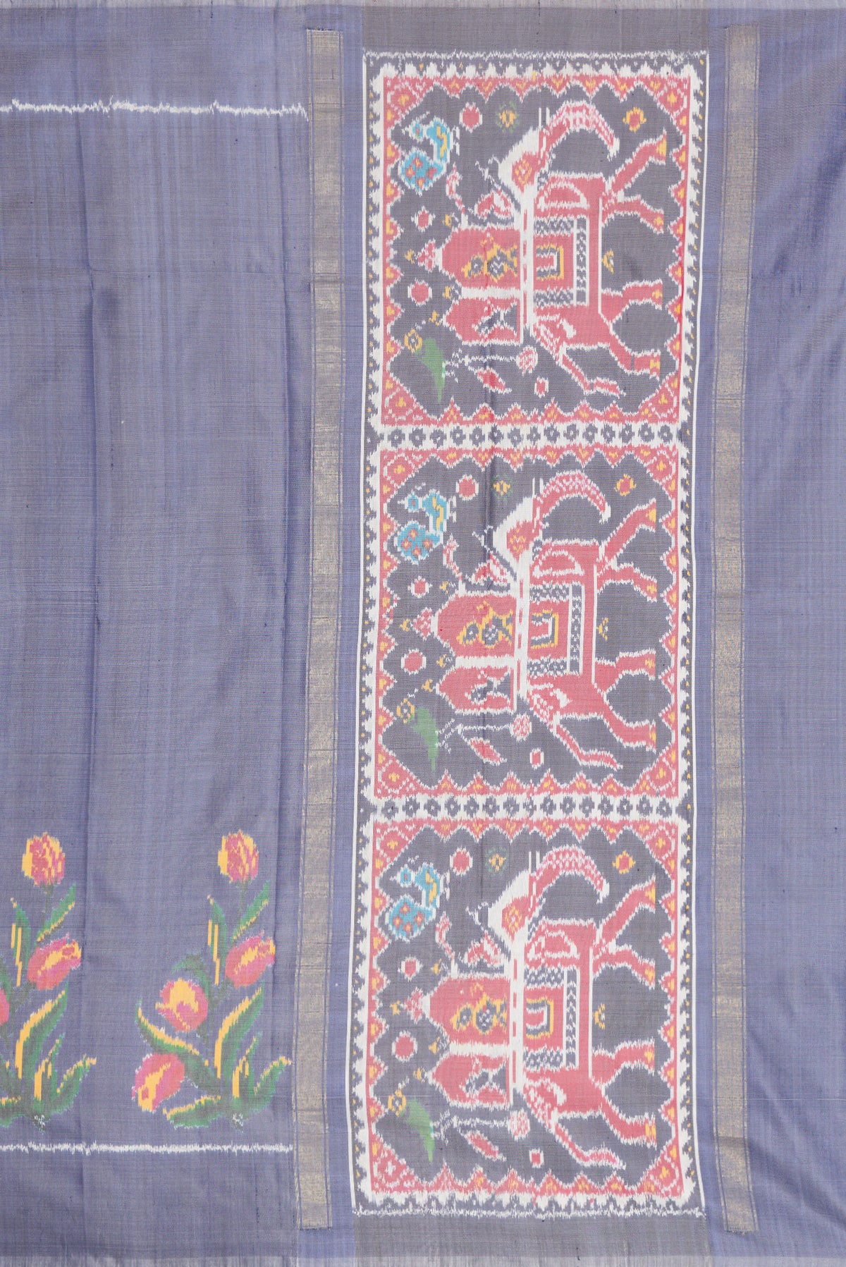 Close up image of the pallu of Grey Dual Tone Double Ikat Saree with Plain Body and Fancy Border. 