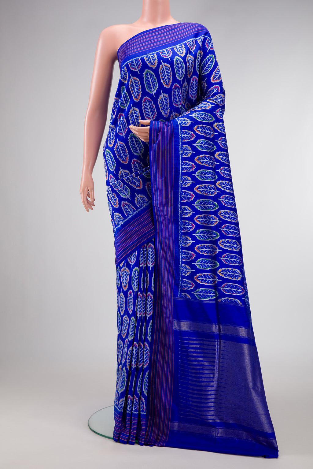 Royal Blue Dual Tone Double Ikat Saree with Ikat Print on the body and Thread Border.  displayed on a mannequin