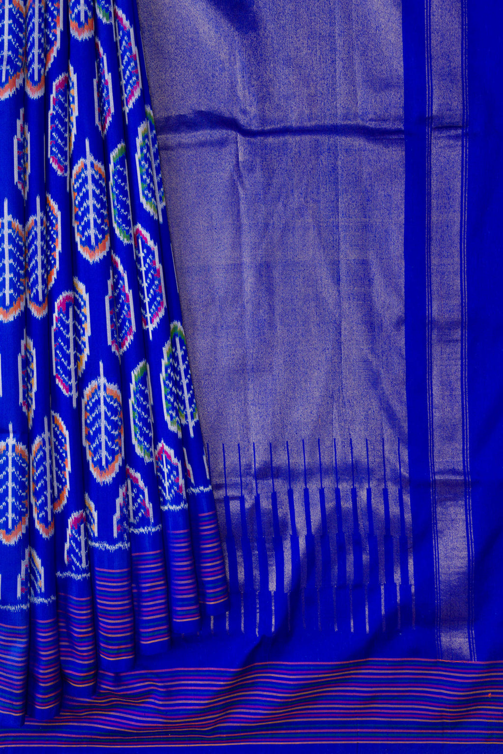 Pleats and pallu of Royal Blue Dual Tone Double Ikat Saree with Ikat Print on the body and Thread Border. 