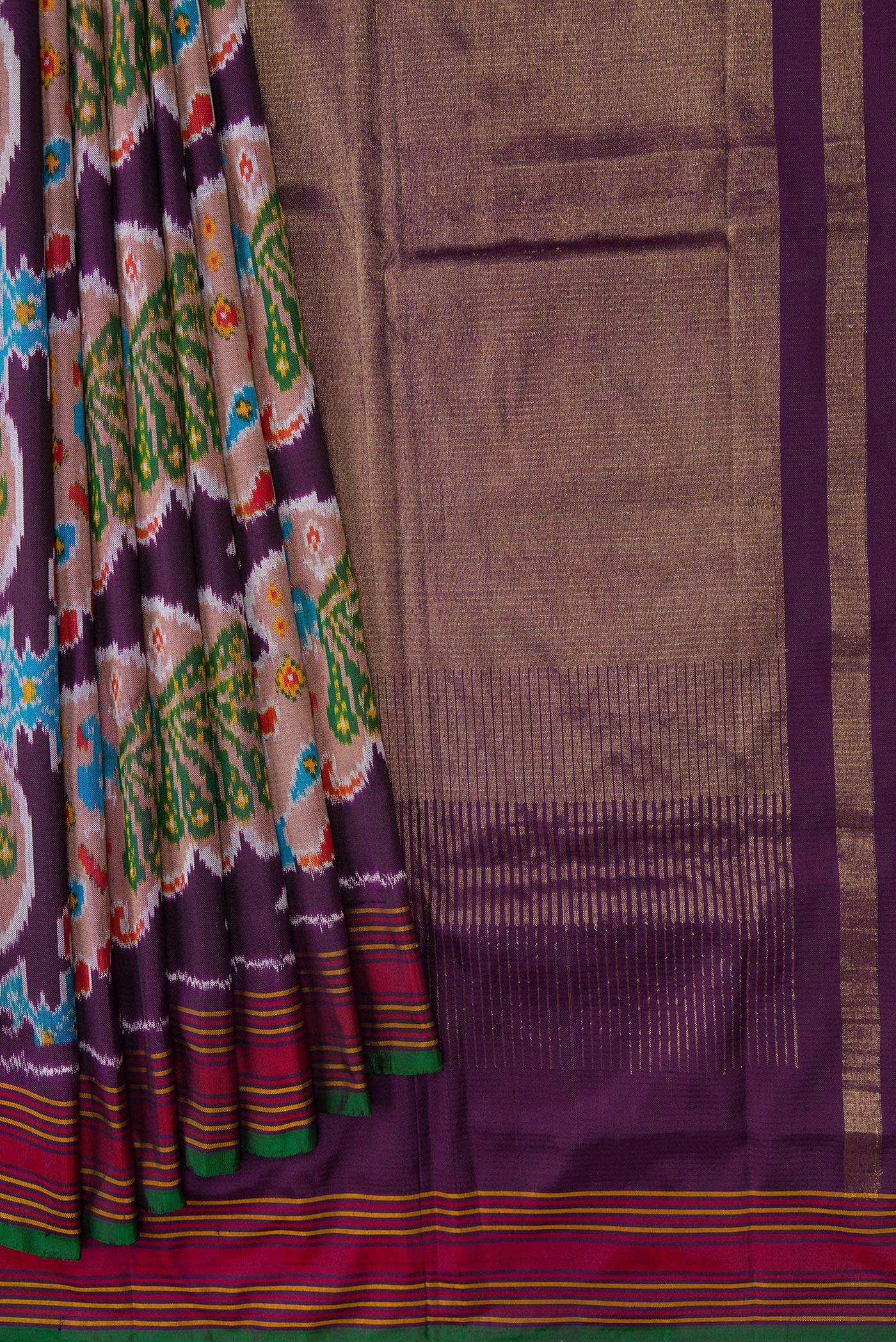 Pleats and pallu of Burgundy Dual Tone Double Ikat Saree with Ikat Print on the body and Thread Border. 