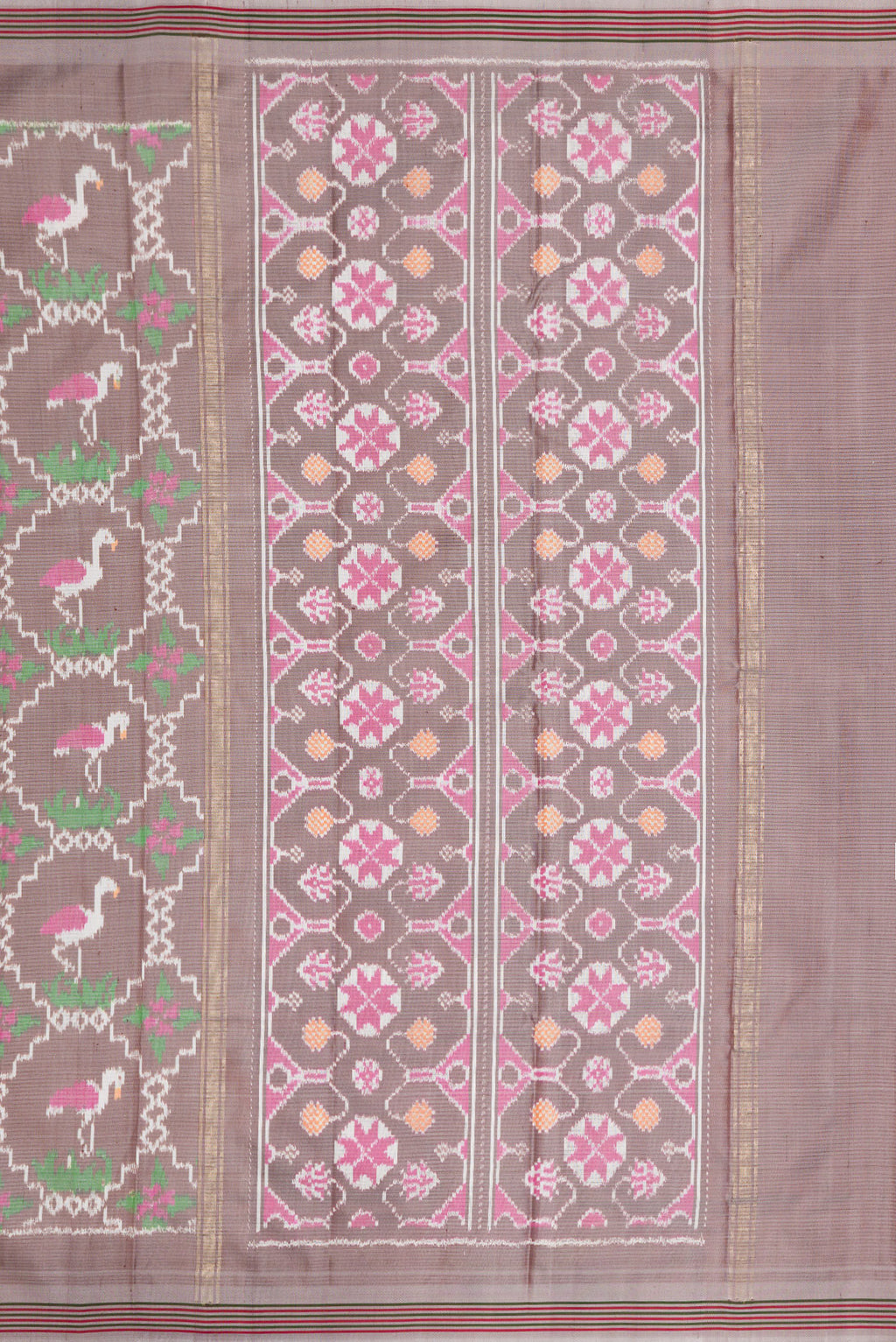 Close up image of the pallu of Grey Dual Tone Double Ikat Saree with Ikat Print on the body and Thread Border. 