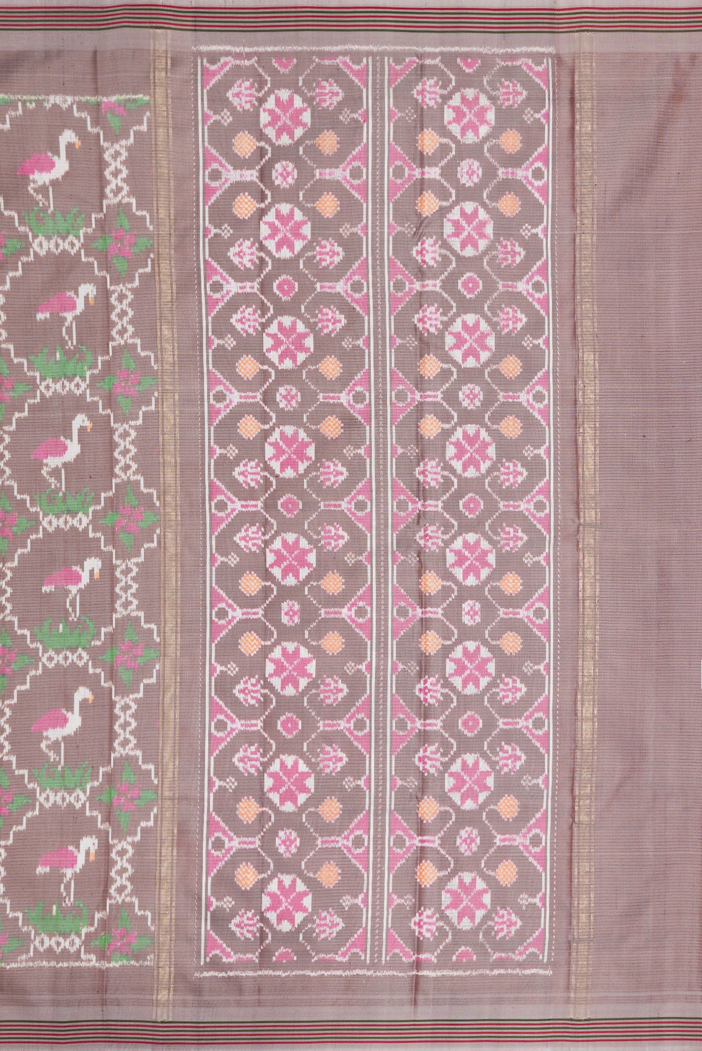 Close up image of the pallu of Grey Dual Tone Double Ikat Saree with Ikat Print on the body and Thread Border. 