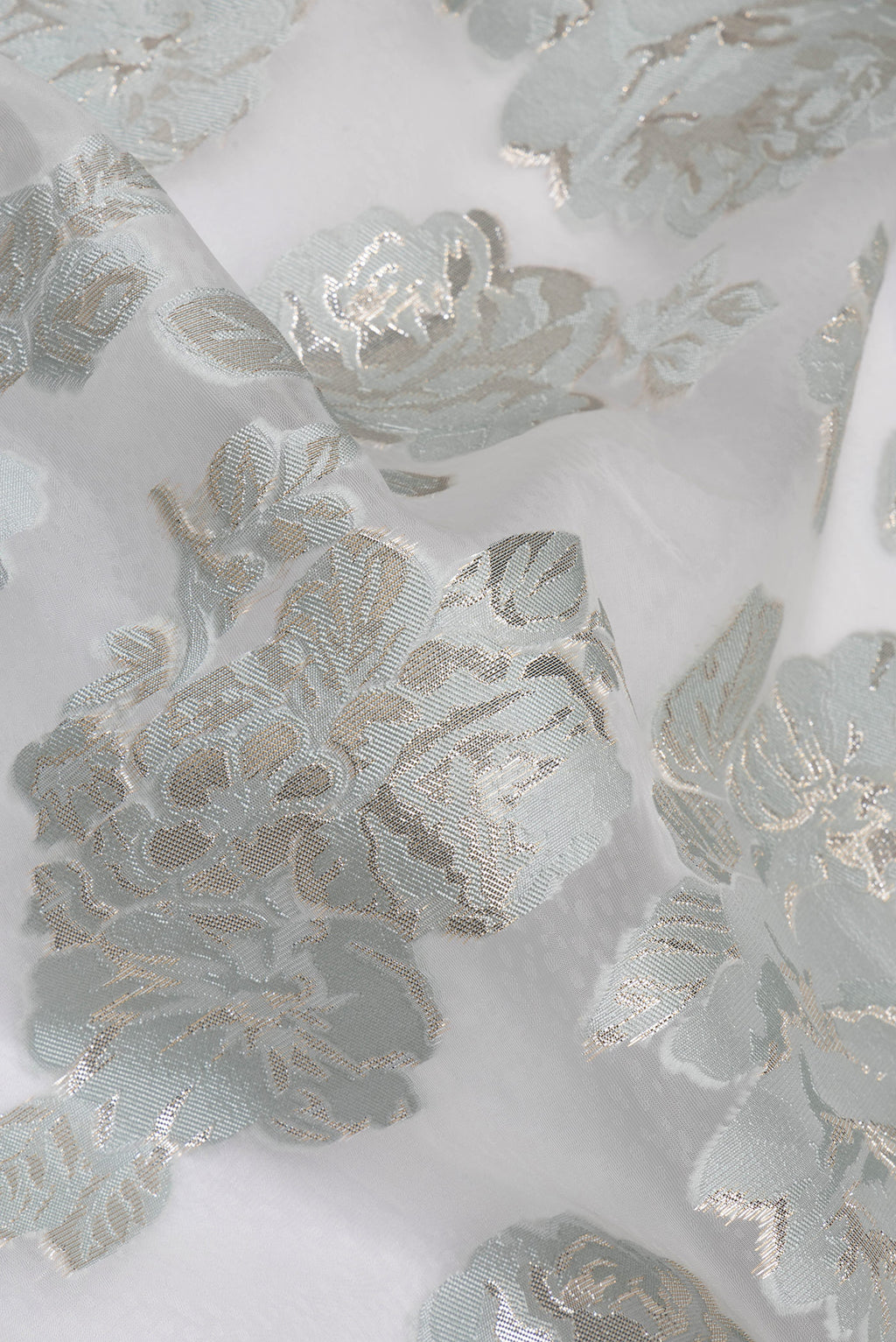 Close up of Blue Grey Dual Tone Organza Saree with Embroidery on the body and Embroidery Border.  displaying folds