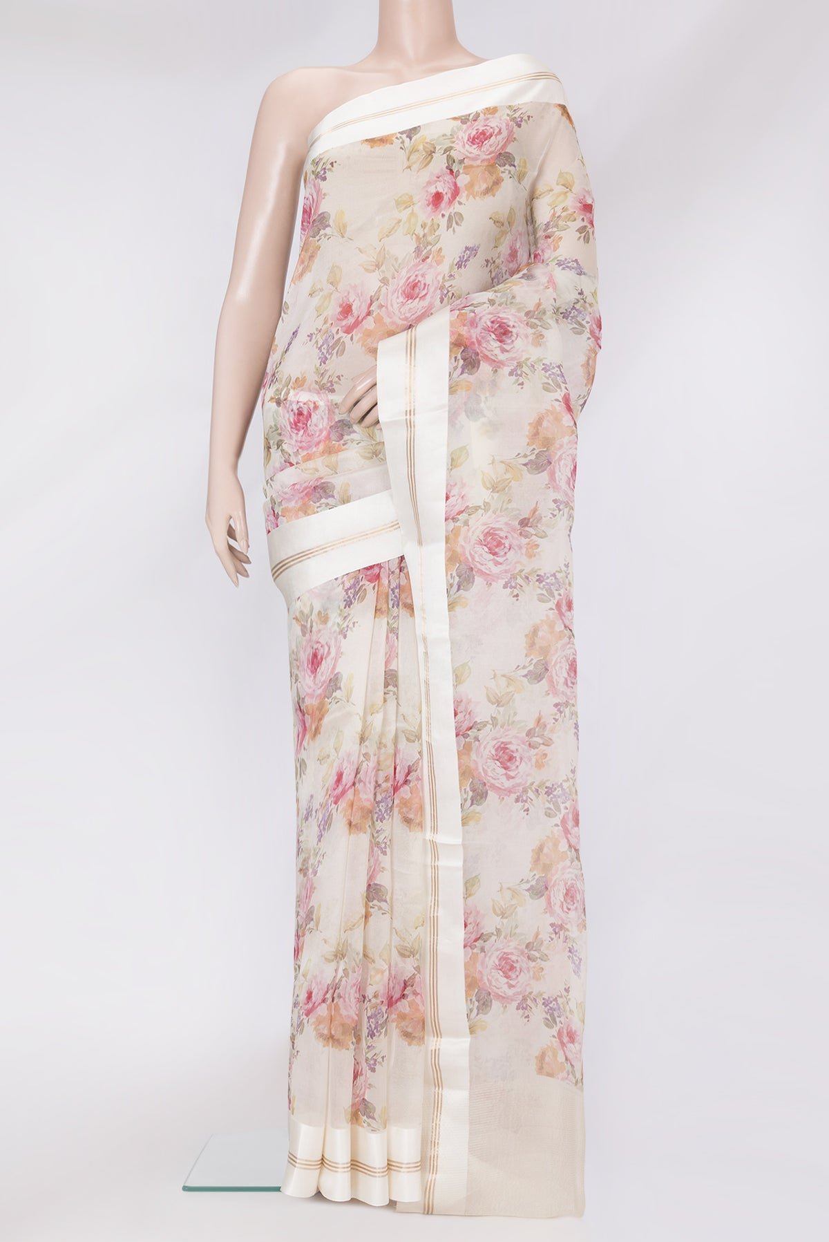 Off White Organza Silk Saree with Floral Print on the body and Plain Border.  displayed on a mannequin