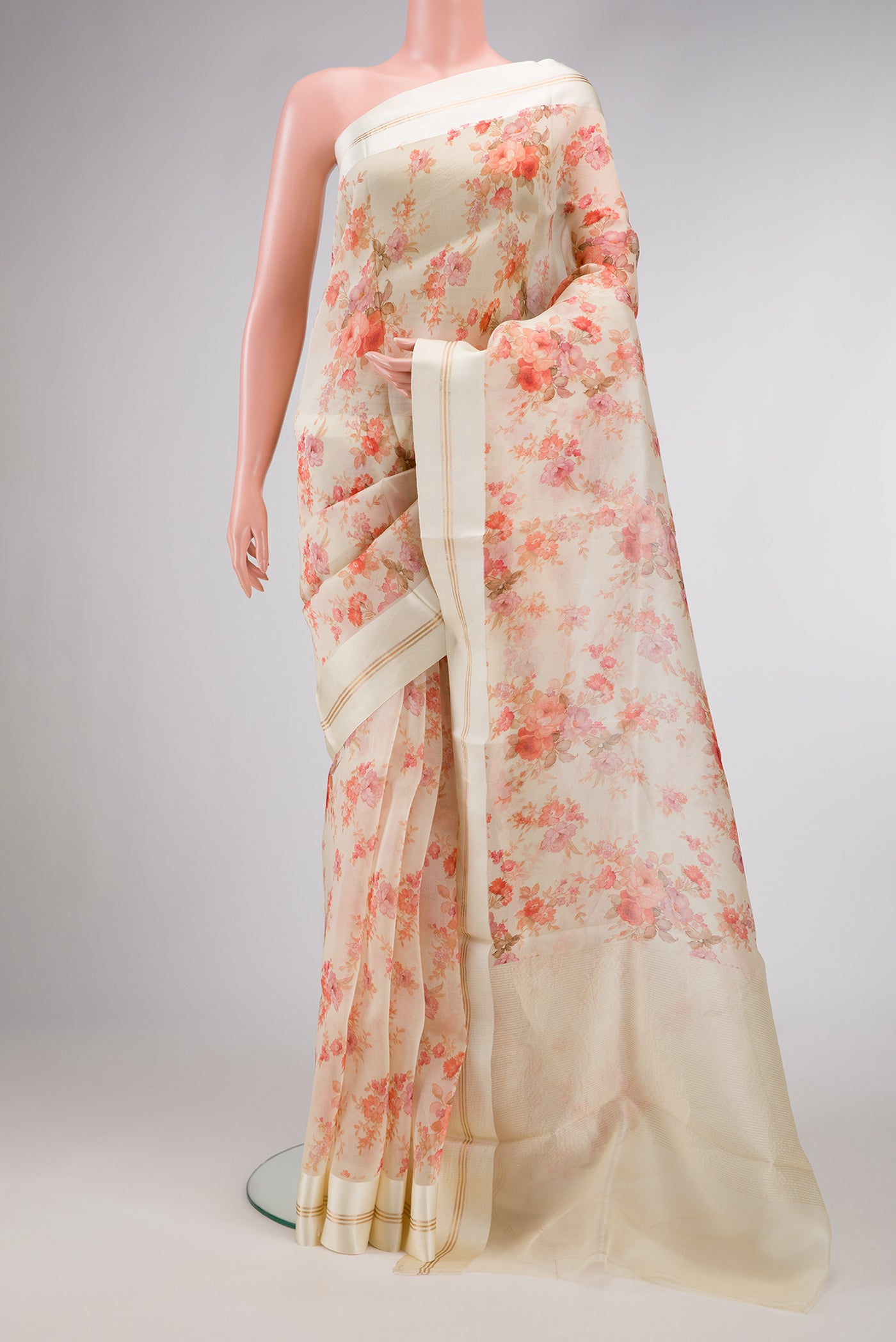 Sandal Dual Tone Organza Silk Saree with Printed design on the body and Zari And Thread Border.  displayed on a mannequin