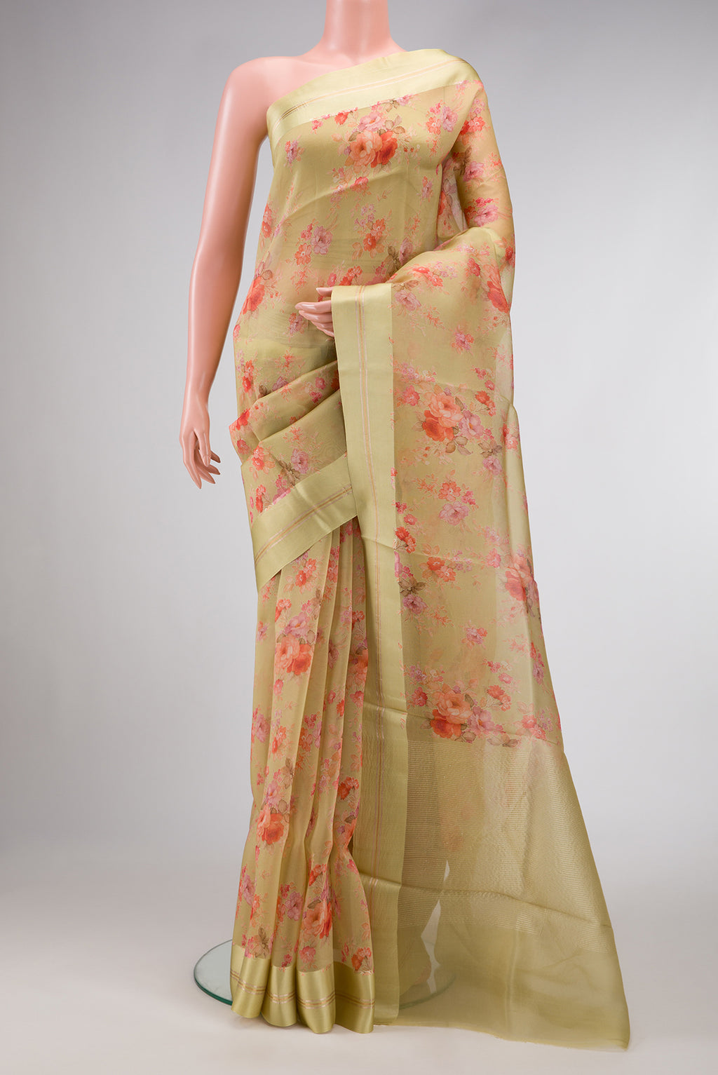 Pista Green Dual Tone Organza Silk Saree with Printed design on the body and Zari And Thread Border.  displayed on a mannequin