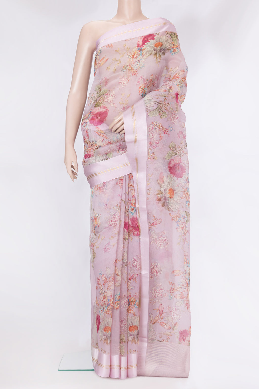 Rose pink Organza Silk Saree with Floral Print on the body and Plain Border.  displayed on a mannequin