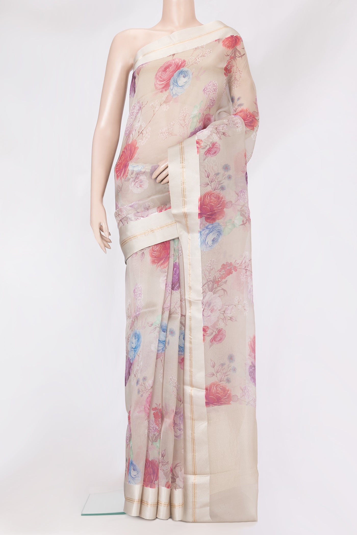 Beige Organza Silk Saree with Floral Print on the body and Satin Border.  displayed on a mannequin
