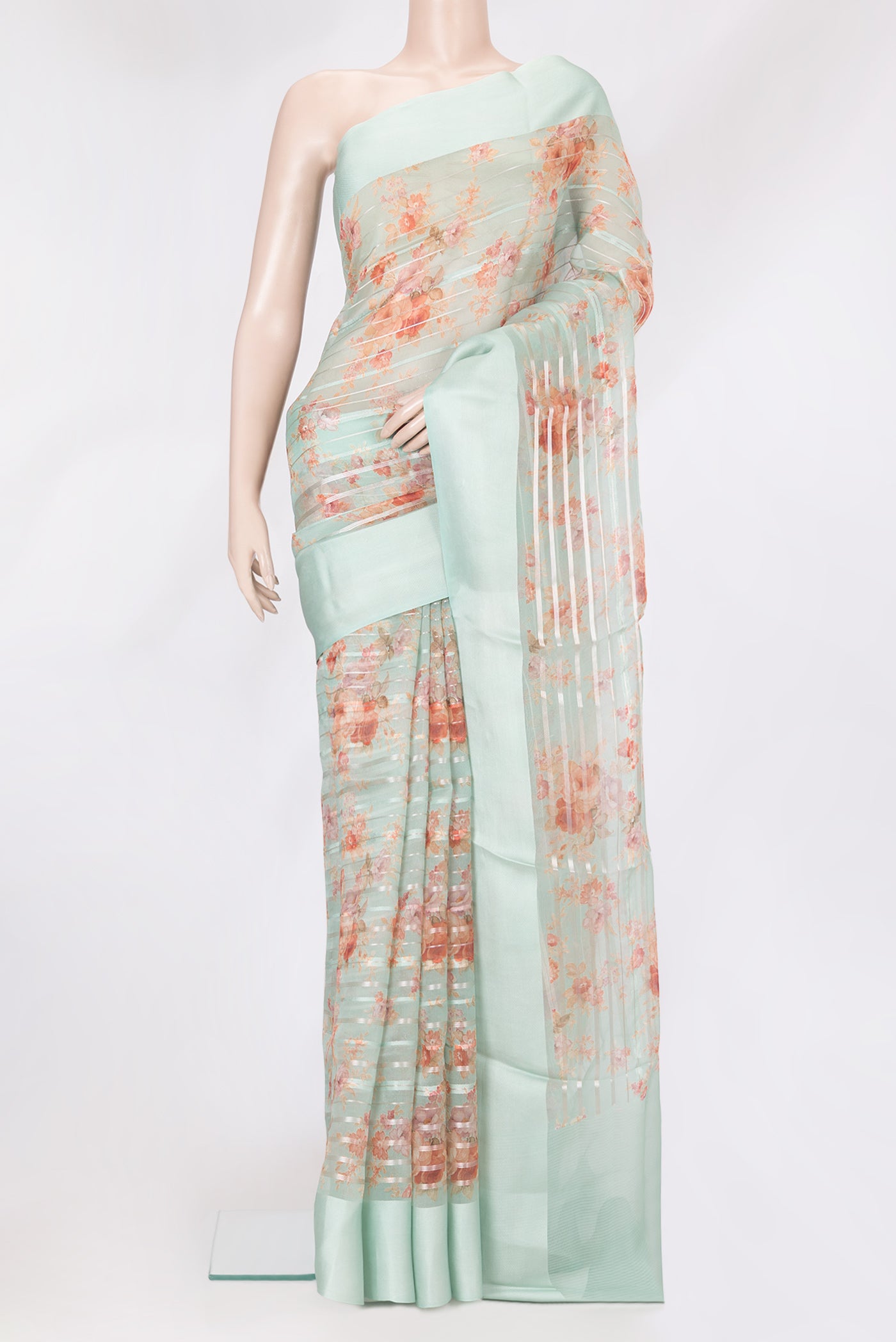 Sea Green Organza Silk Saree with Stripes on the body and Thread Border.  displayed on a mannequin