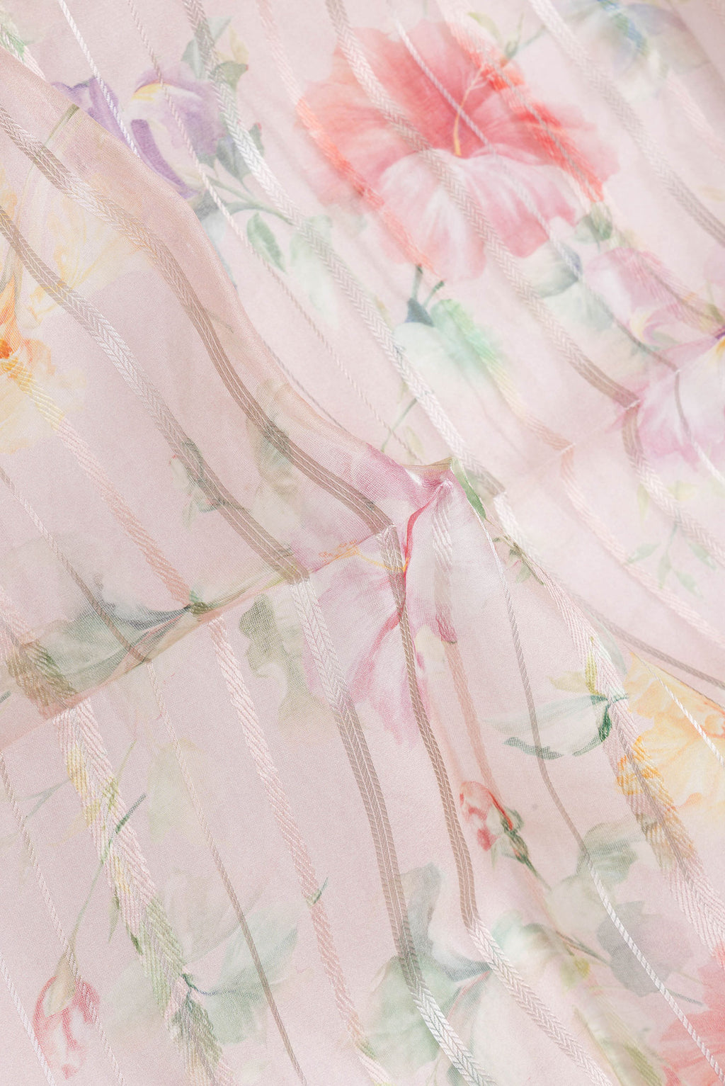 Close up of Rose Gold Dual Tone Organza Silk Saree with Stripes on the body and Thread Border.  displaying folds