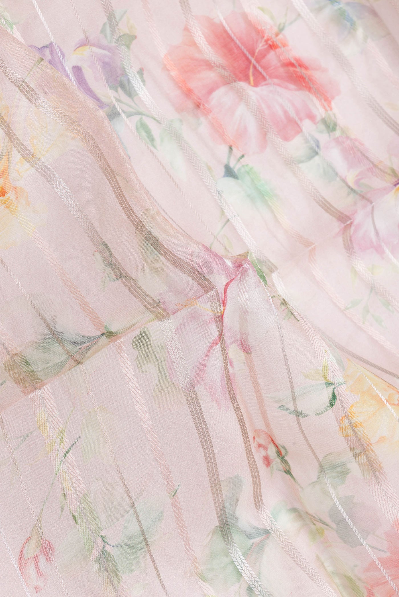 Close up of Rose Gold Dual Tone Organza Silk Saree with Stripes on the body and Thread Border.  displaying folds