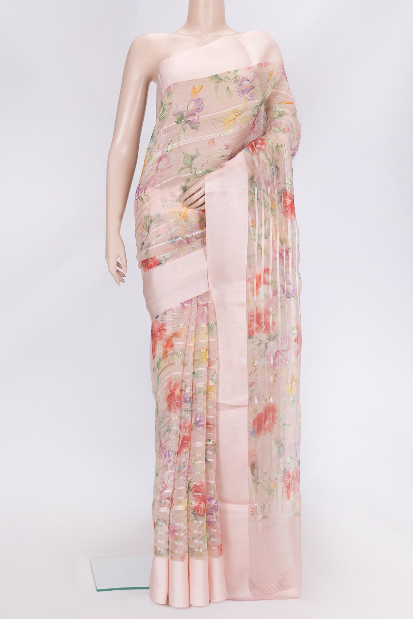 Rose Gold Dual Tone Organza Silk Saree with Stripes on the body and Thread Border.  displayed on a mannequin
