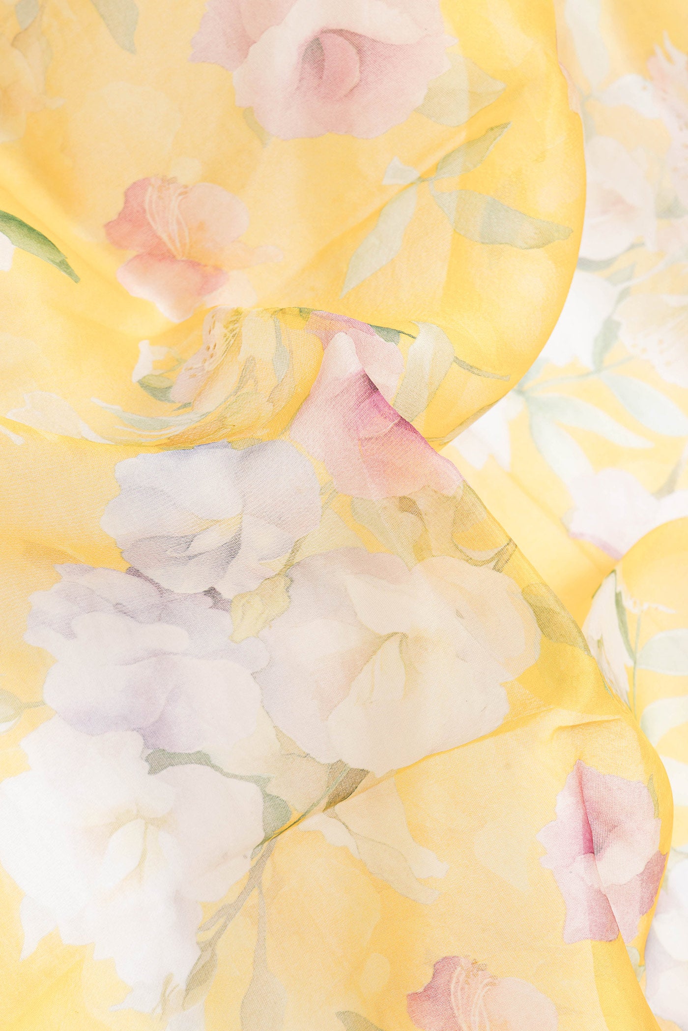 Close up of Yellow Dual Tone Organza Silk Saree with Printed design on the body and Zari Border.  displaying folds