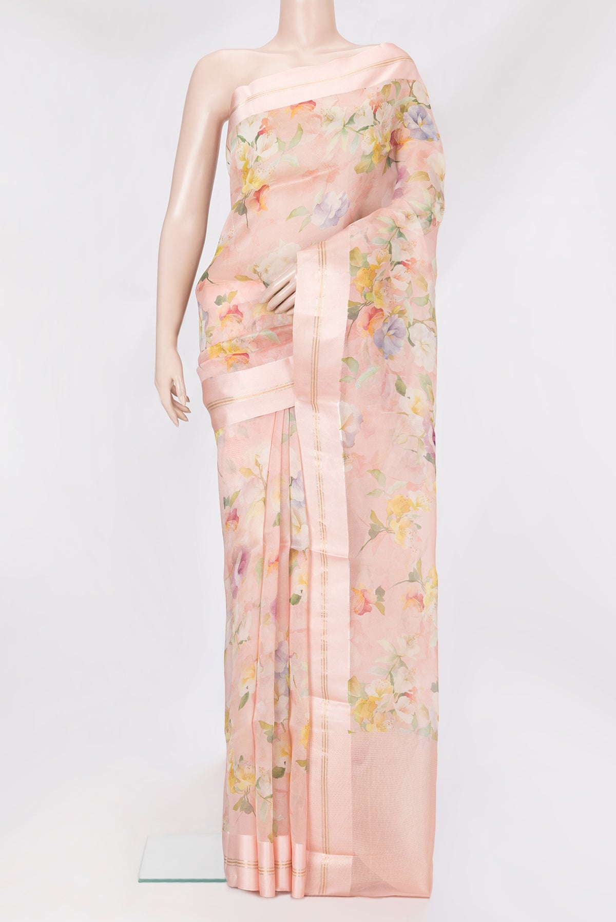 Rose Gold Organza Silk Saree with Floral Print on the body and Satin Border.  displayed on a mannequin