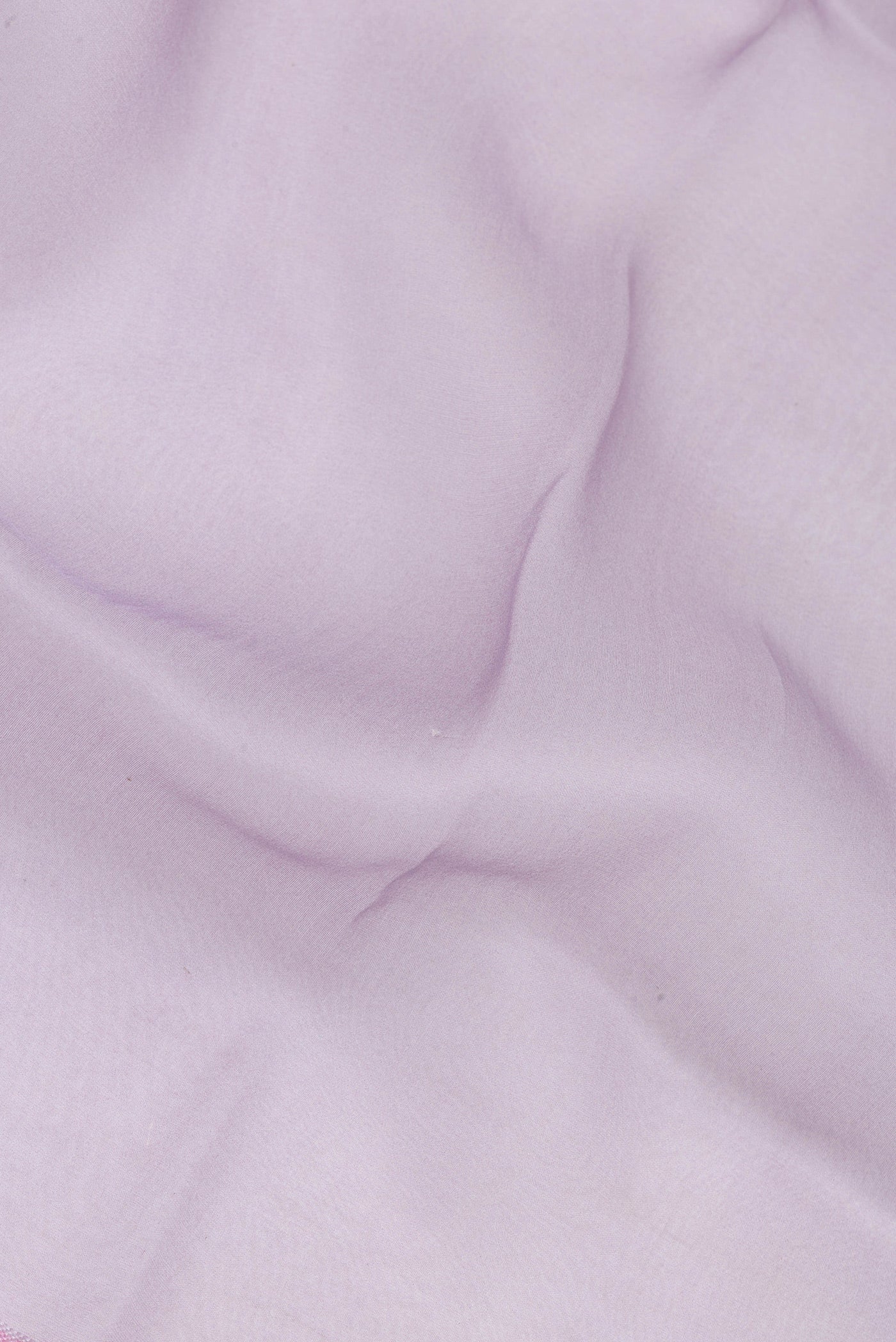 Close up of Lavender Organza Silk Saree with Plain Body and Printed Border.  displaying folds