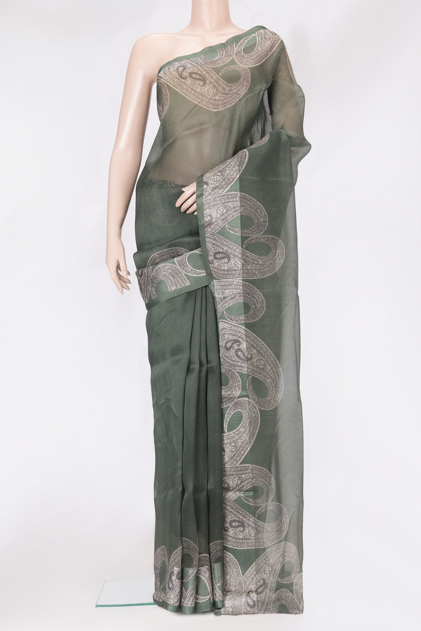 Green Organza Silk Saree with Plain Body and Printed Border.  displayed on a mannequin