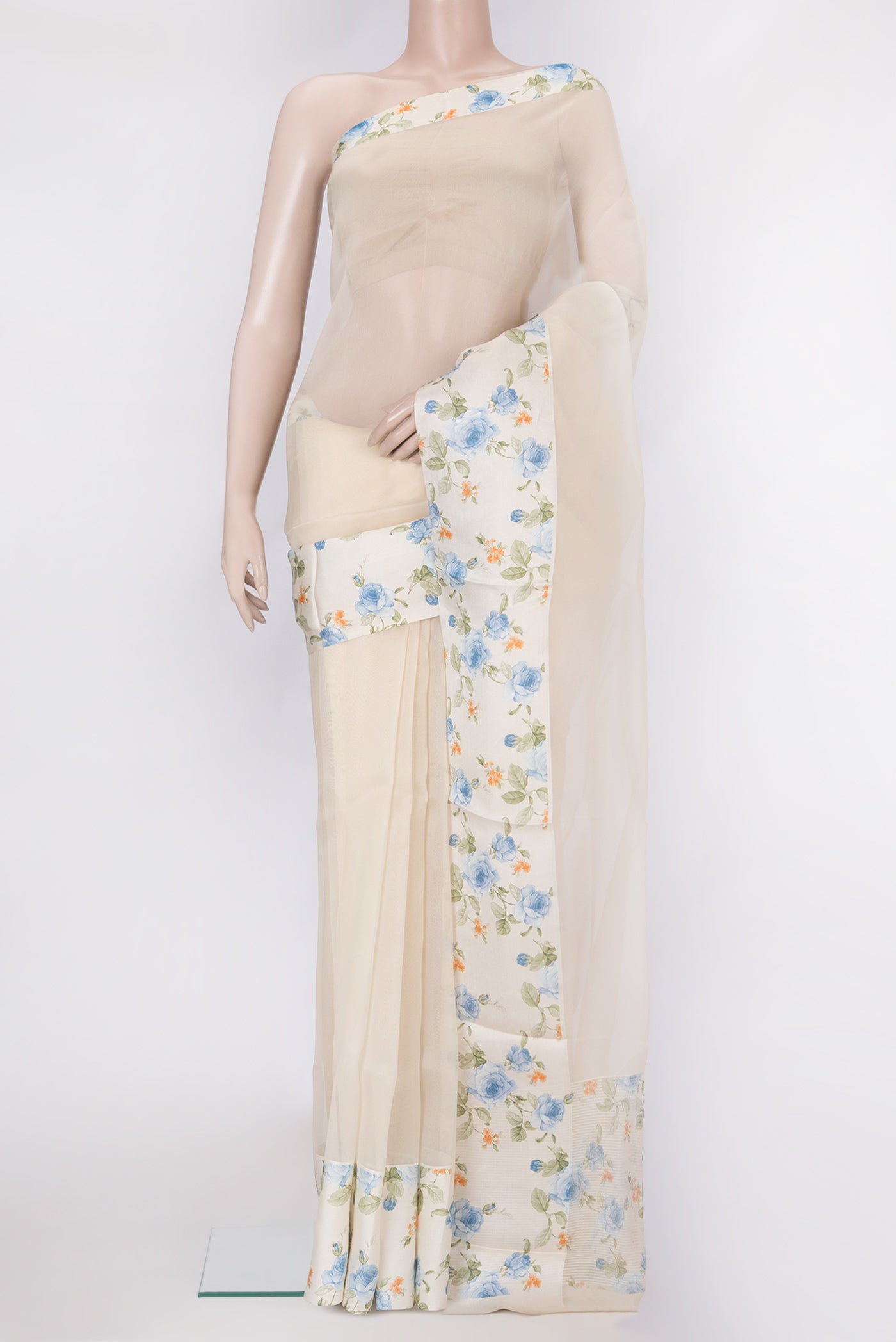 Beige Organza Silk Saree with Plain Body and Printed Border.  displayed on a mannequin