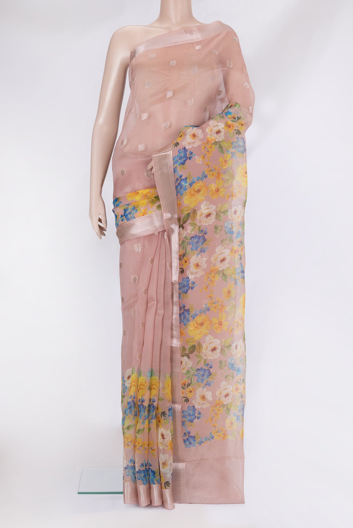Rose Gold Organza Silk Saree with Zari Butta on the body and Fancy Border.  displayed on a mannequin