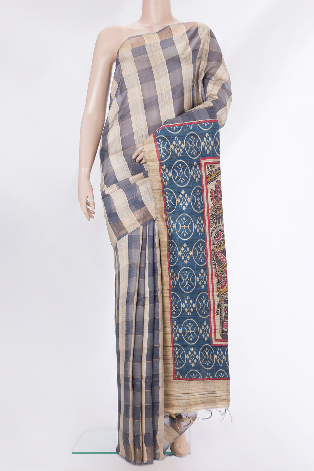 Multi Color Tussar Saree with Checked design on the body and Zari Border.  displayed on a mannequin