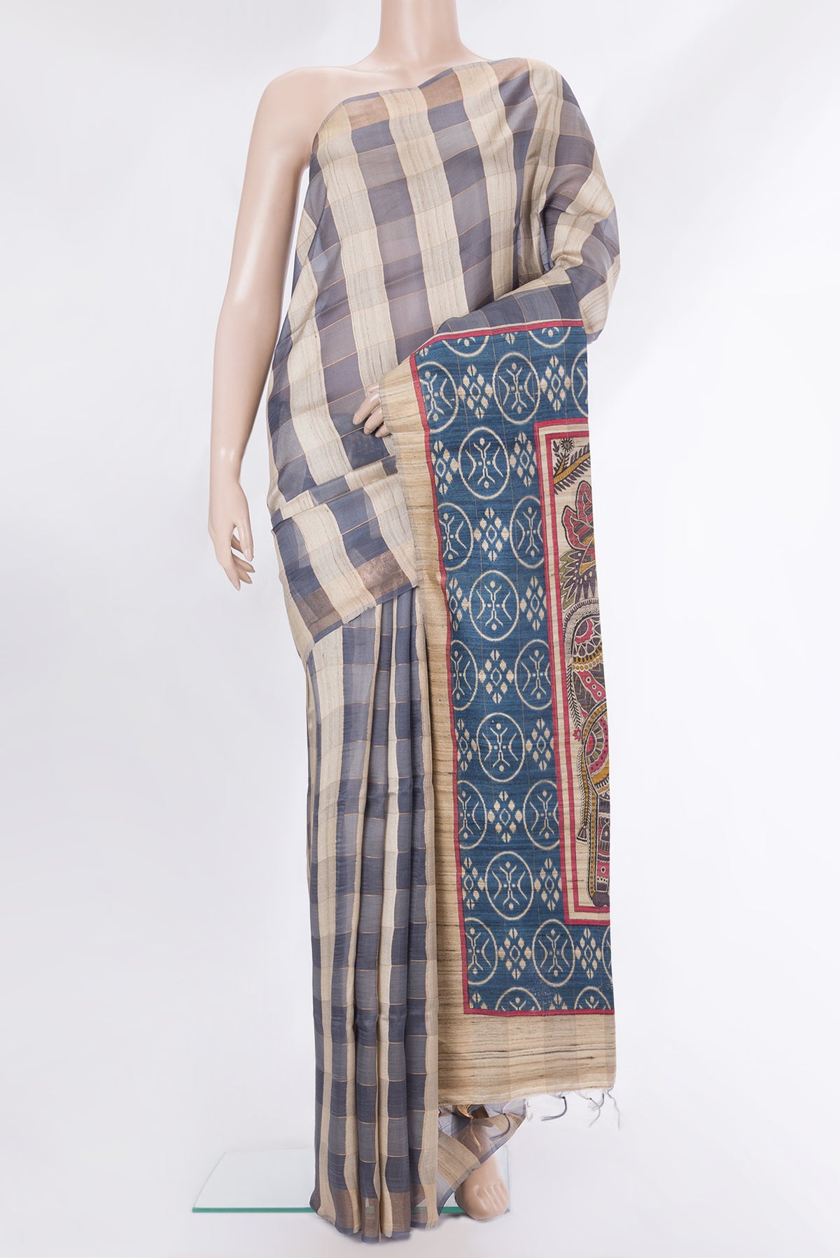 Multi Color Tussar Saree with Checked design on the body and Zari Border.  displayed on a mannequin