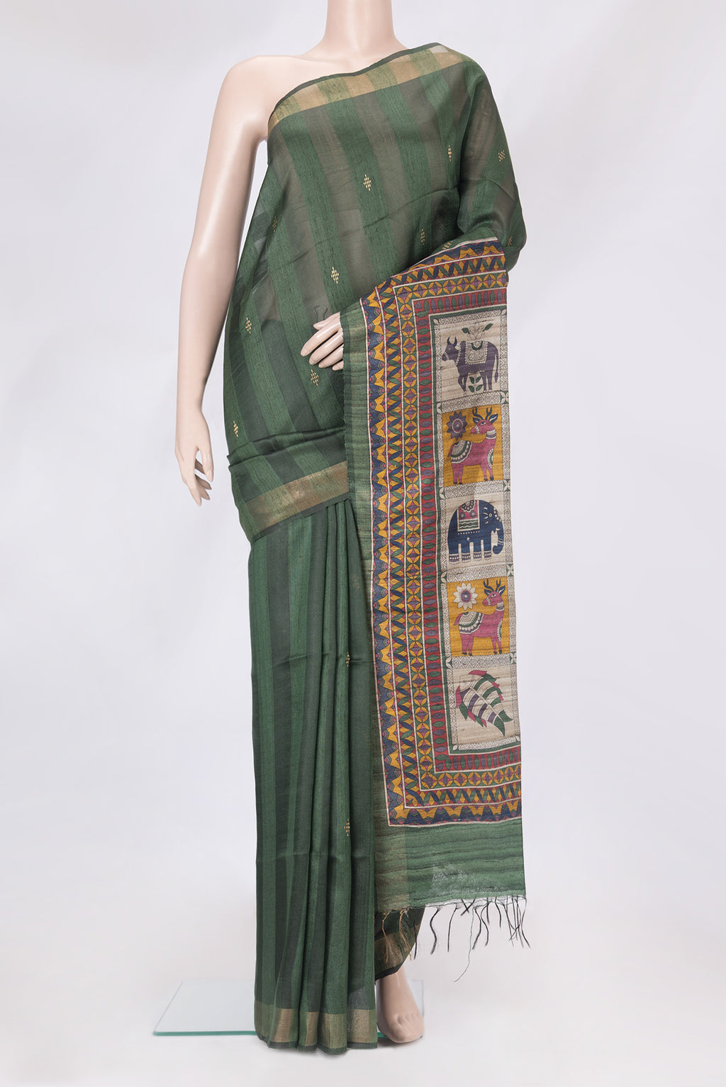 Olive Green Tussar Silk Saree with Art Illustrations on the body and Zari Border.  displayed on a mannequin